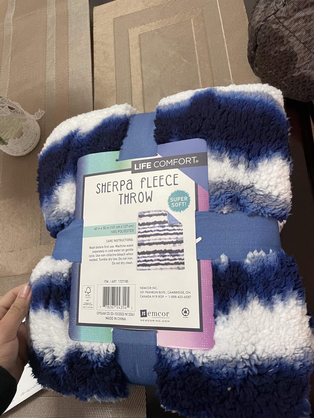 The back of a Life Comfort Sherpa Fleece Throw package, showing the care instructions and the item number
